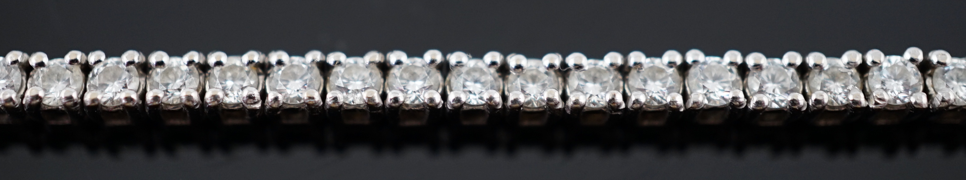 A modern 18ct white gold and diamond set line bracelet